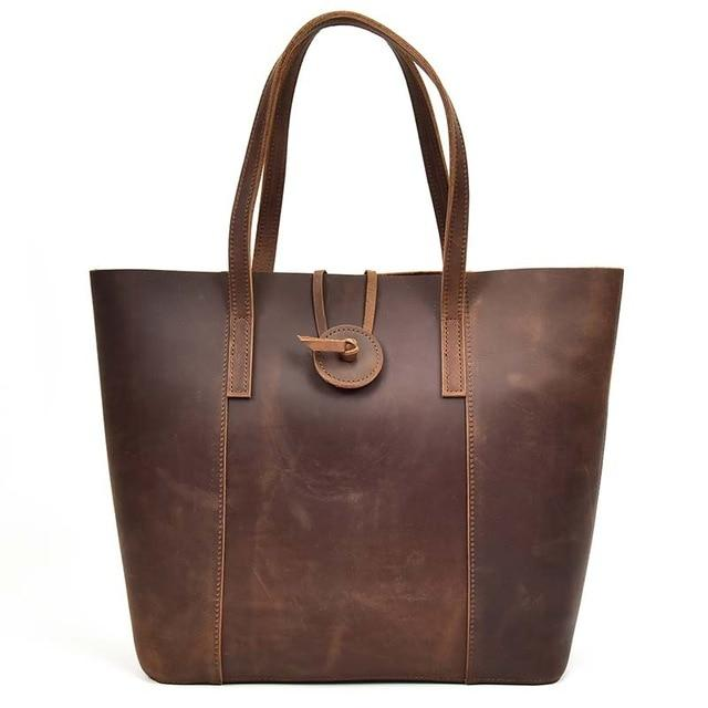 Handcrafted leather tote bag from Start2Finish, the Taavi Tote, with sturdy handles and spacious interior for accessories.