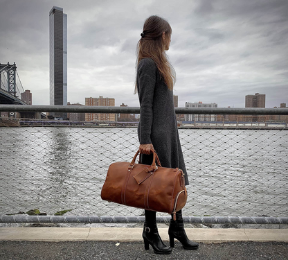 Large leather duffle bag from Start2Finish Dagny Weekender with sturdy handles and spacious interior for travel accessories.