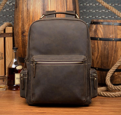Vintage leather backpack from Start2Finish featuring adjustable straps, spacious main compartment, and classic design.