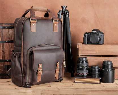 Large leather backpack camera bag by Start2Finish with tripod holder, featuring multiple compartments and adjustable straps.