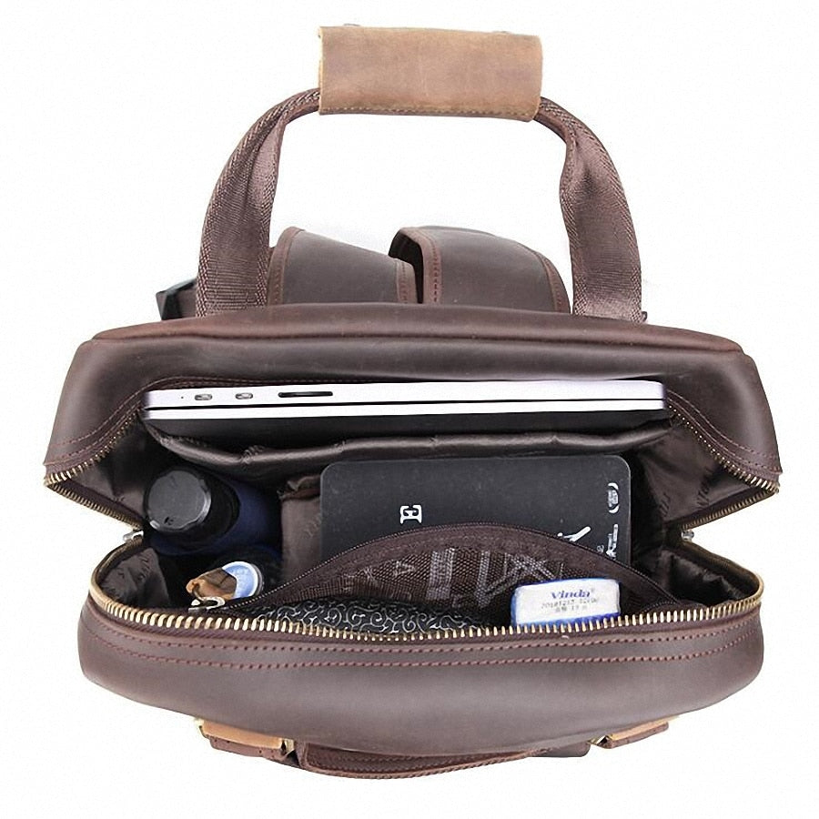Large leather backpack camera bag with tripod holder from Start2Finish, featuring multiple compartments and adjustable straps.