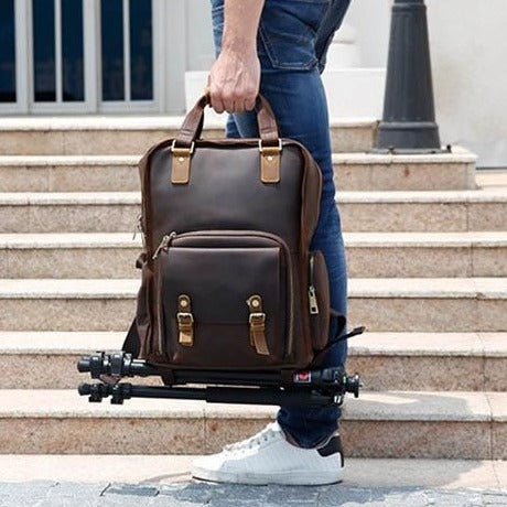 Large leather camera backpack with tripod holder by Start2Finish, featuring multiple compartments and sturdy leather construction.