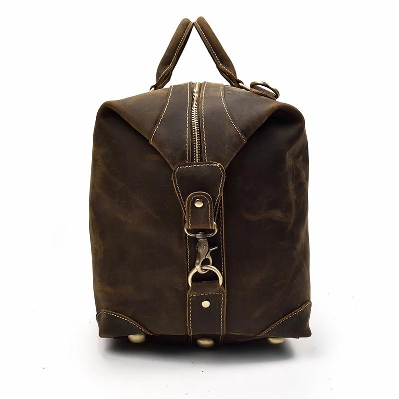 Vintage leather Eira Duffle Bag by Start2Finish, stylish weekender accessory with sturdy handles and spacious interior.