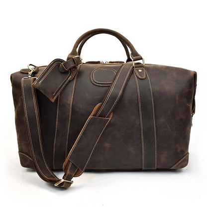 Vintage leather Eira Duffle Bag by Start2Finish, featuring sturdy handles and spacious interior for travel and weekend trips.
