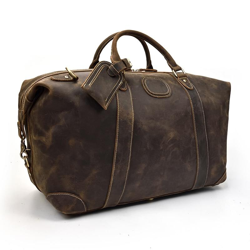 Vintage leather Eira Duffle Bag by Start2Finish, featuring sturdy handles and spacious interior for travel and weekend getaways.