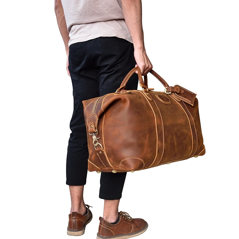 Start2Finish Eira Duffle Bag in vintage leather, showing its spacious design and sturdy handles for weekend travel.