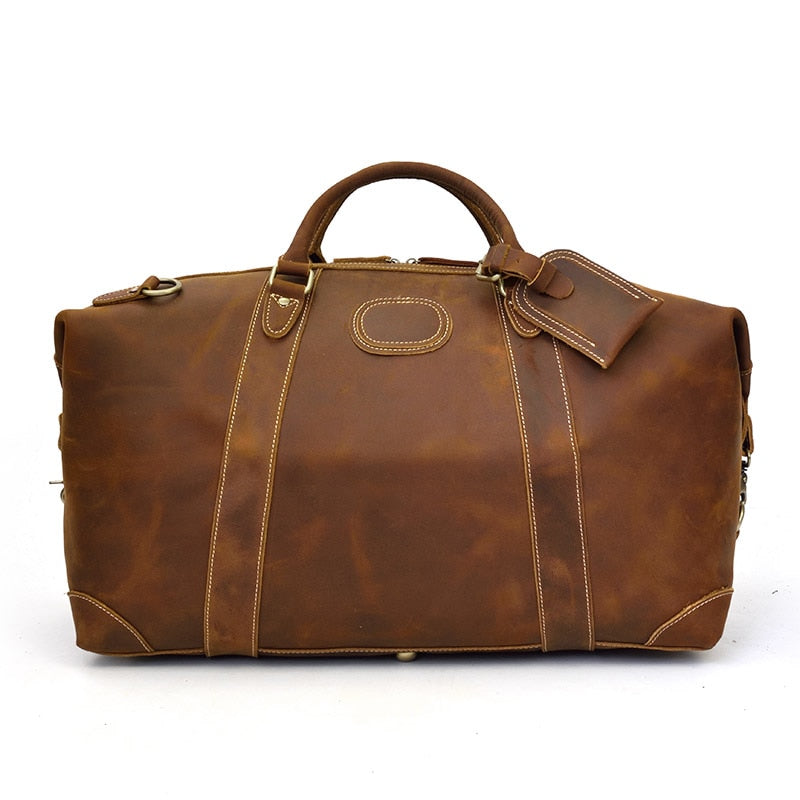 Vintage leather Eira duffle bag by Start2Finish, showing the spacious weekender bag with sturdy handles and classic design.