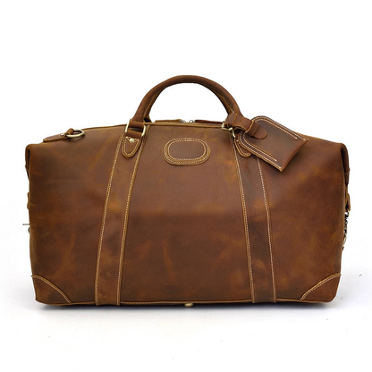 Vintage leather Eira duffle bag by Start2Finish, showing the spacious weekender bag with sturdy handles and classic design.