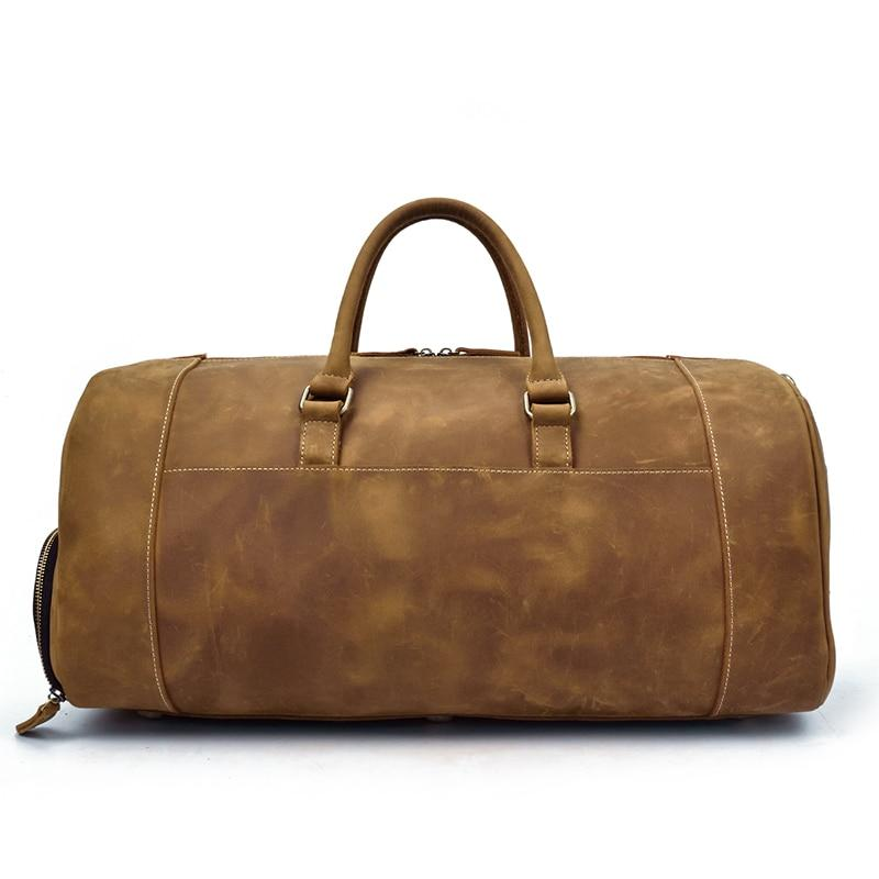 Handmade leather duffle bag from Start2Finish Bard Weekender, with sturdy handles and spacious interior for travel accessories.