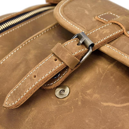 Handmade leather duffle bag from Start2Finish, The Bard Weekender, with sturdy handles and spacious interior for travel accessories.