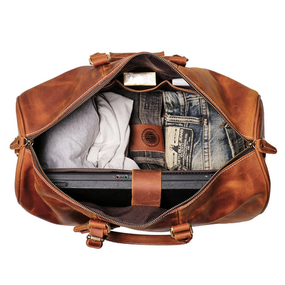 Start2Finish Brandt Weekender small leather duffle bag with handles and zipper closure, showing its compact, stylish design.