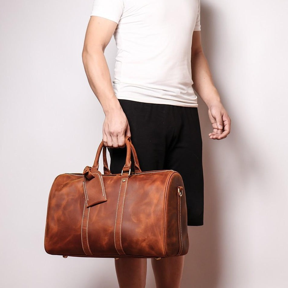 Start2Finish Brandt Weekender small leather duffle bag with sturdy handles and spacious interior, perfect for travel accessories.