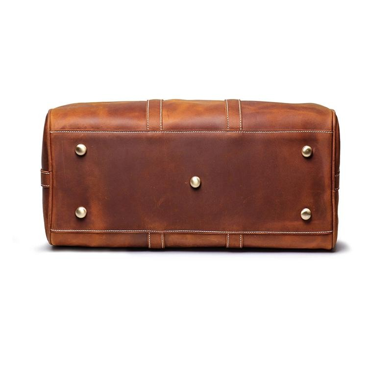 Start2Finish Brandt Weekender small leather duffle bag with sturdy handles and sleek design, perfect for travel accessories.