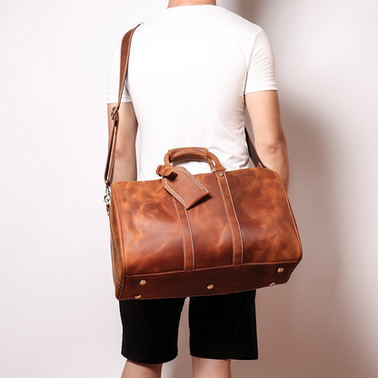 Start2Finish Brandt Weekender small leather duffle bag with handles and zip closure, showing its compact and stylish design.
