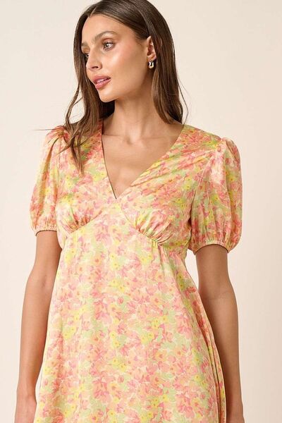 Jade Icarus Mittoshop printed V-neck puff sleeve mini dress for women, featuring a colorful pattern and stylish puff sleeves.
