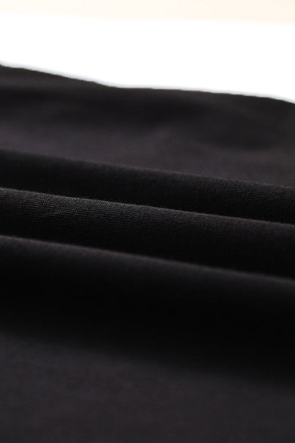 Black strappy hollow-out neck tank top from Harlequin Daisy, showcasing its stylish design and lightweight fabric.