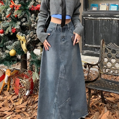 High-waisted skinny denim skirt for girls by Carmine Juneberry, featuring a fitted silhouette and classic blue denim fabric.