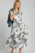 Full size Umgee landscape print midi dress in two-tone design by Jade Icarus, displayed in an automotive-themed setting.