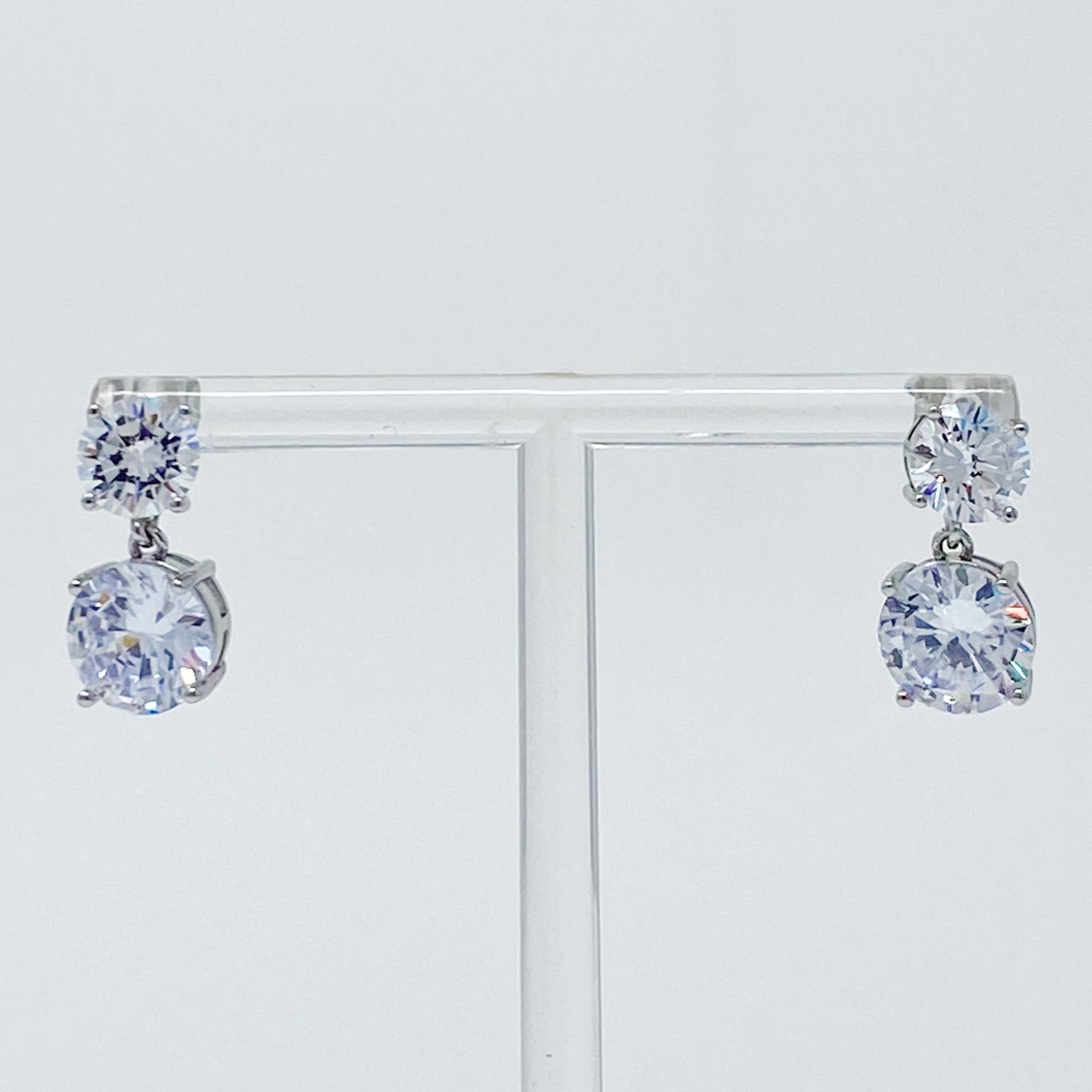 Fuchsia Hercules Double Diamond Dangle Earrings featuring sparkling diamond accents and elegant silver hooks.