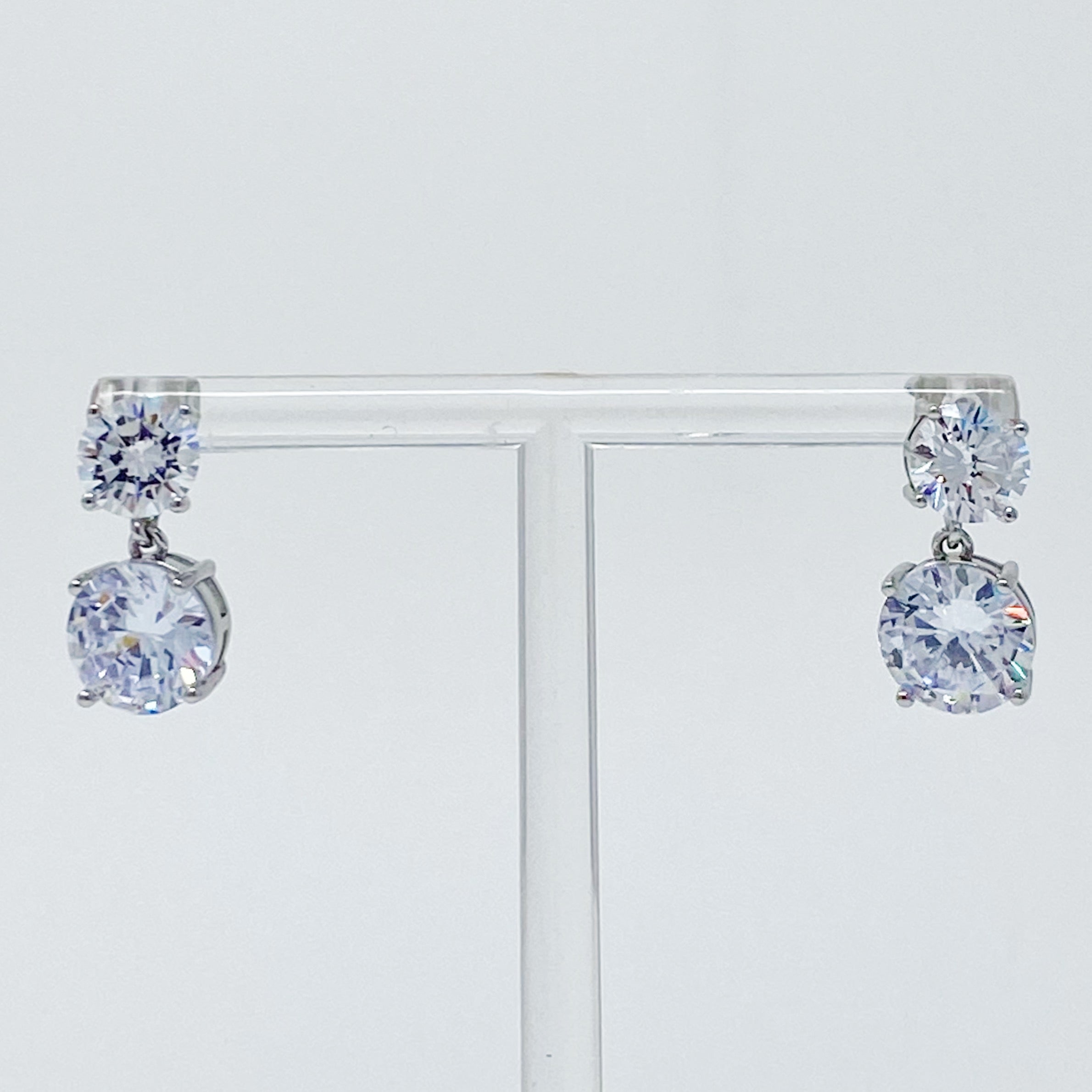 Fuchsia Hercules Double Diamond Dangle Earrings featuring sparkling diamond accents and elegant silver hooks.