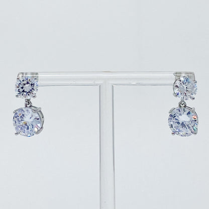 Fuchsia Hercules Double Diamond Dangle Earrings featuring sparkling diamond accents and elegant silver hooks.