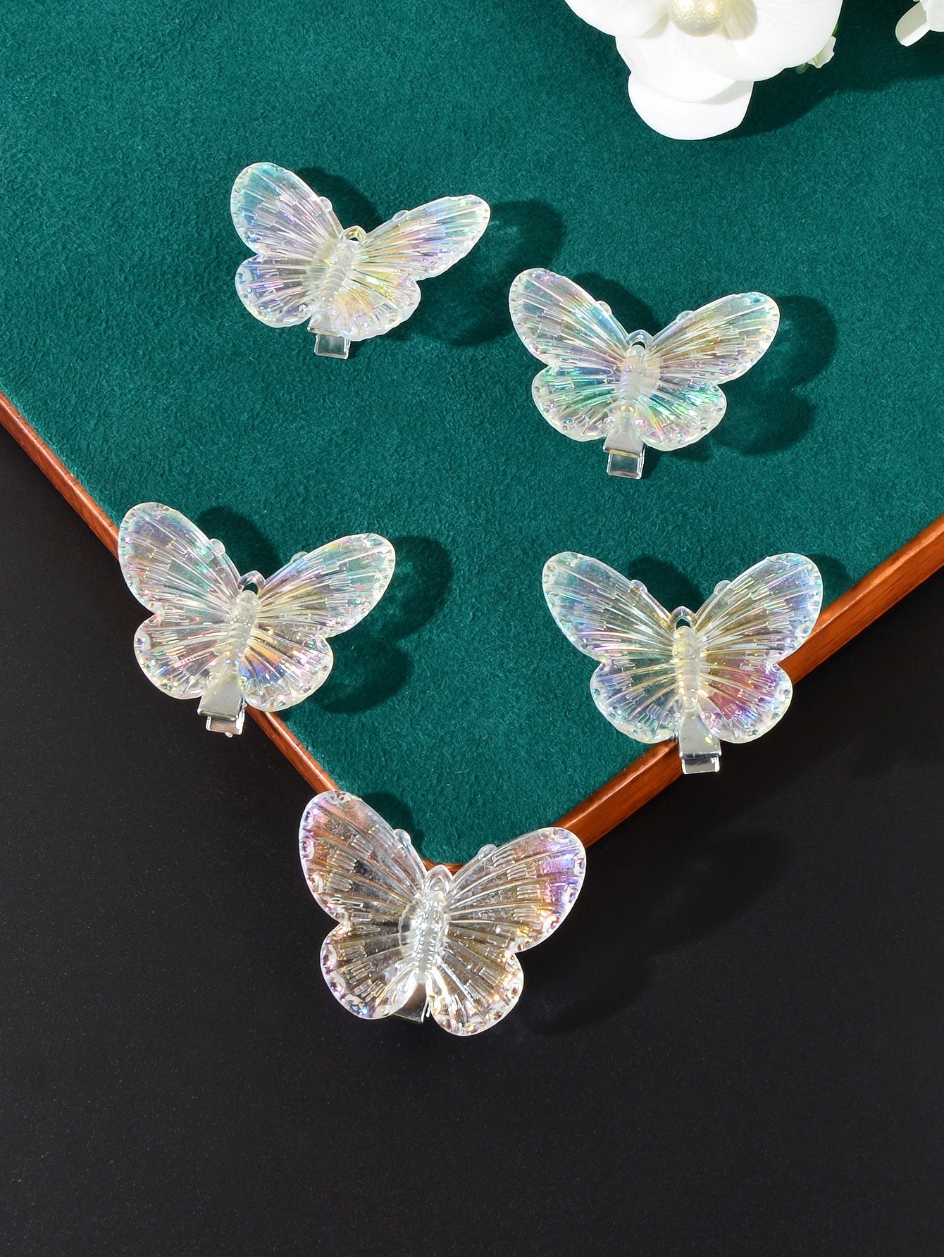 Set of five transparent butterfly hairpins by White Demeter, featuring delicate, glossy butterfly designs for elegant hair styling.