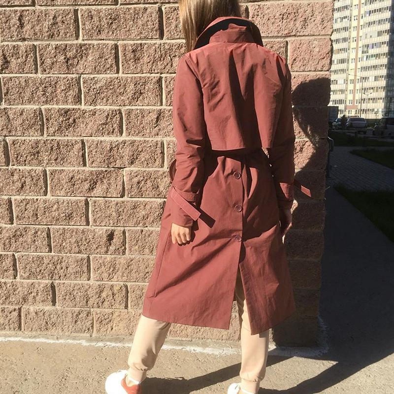 Women’s brick red long trench coat by Jade, V-neck windbreaker with tie, lightweight jacket for women, stylish and gentle.