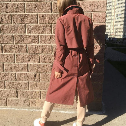 Women’s brick red long trench coat by Jade, V-neck windbreaker with tie, lightweight jacket for women, stylish and gentle.