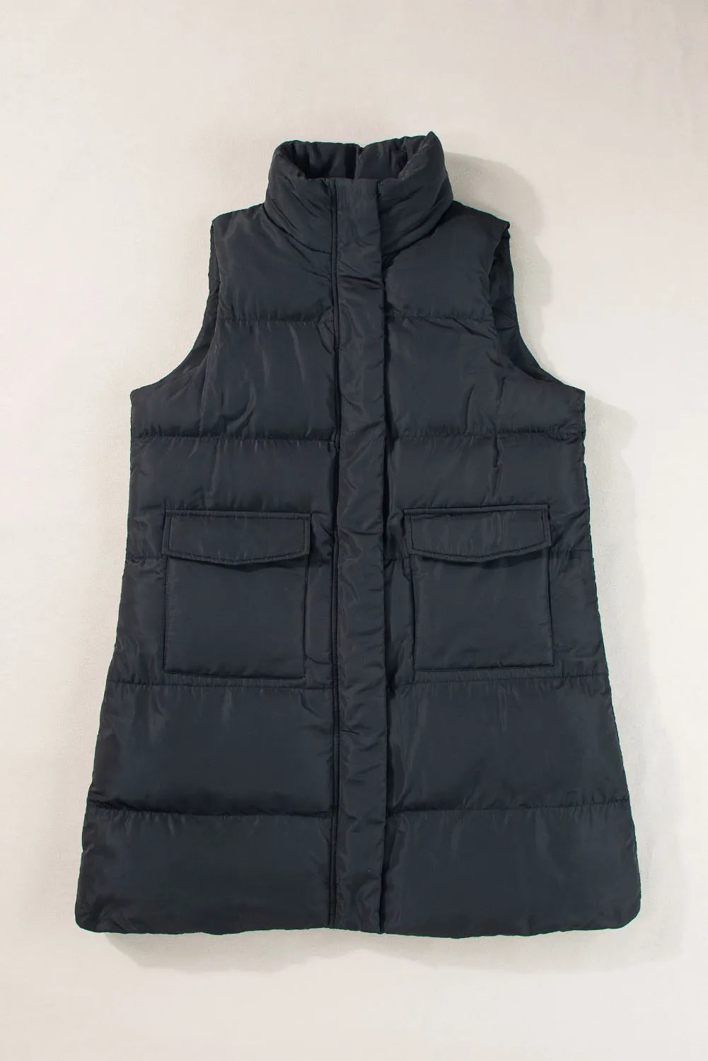 Pear Daisy pocketed zip-up vest coat, stylish and warm for home and garden, shown in a natural outdoor setting.