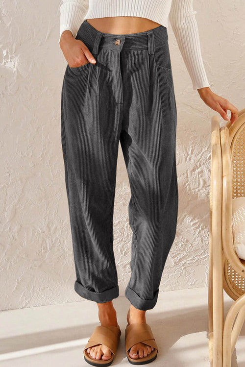 Gray corduroy high waist straight leg pants by Carmine Juneberry, shown on a model with a focus on the fit and texture.