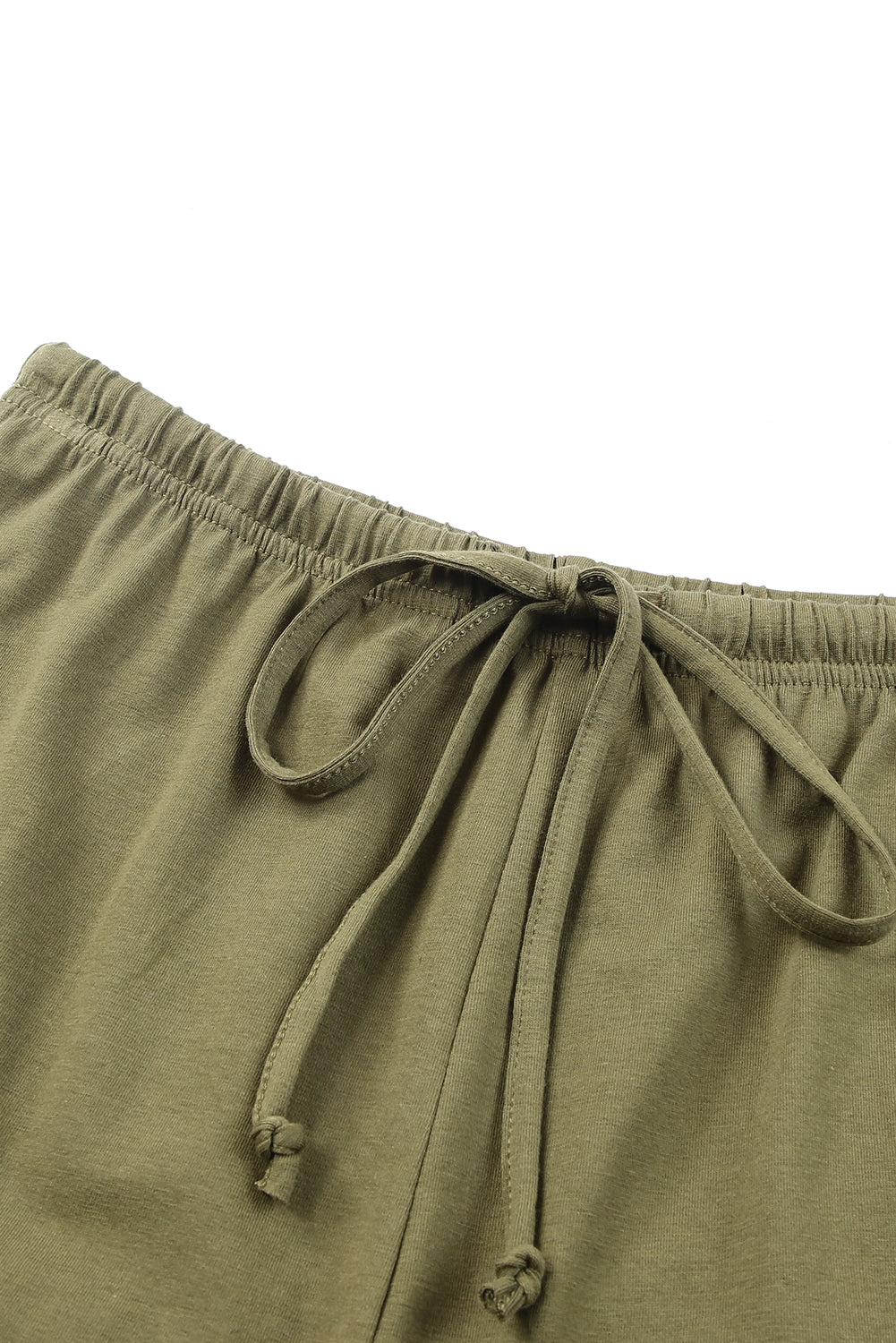 Harlequin Daisy green crew neck tank top and ruffled drawstring shorts lounge set, perfect for casual bath and beauty wear.