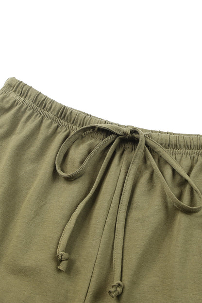 Harlequin Daisy green crew neck tank top and ruffled drawstring shorts lounge set, perfect for casual bath and beauty wear.