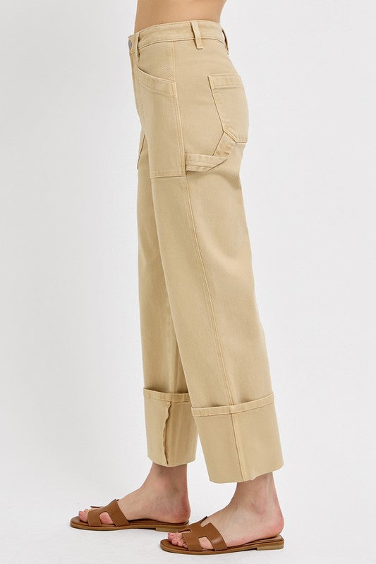 Jade Icarus Risen high-rise wide straight cuffed patch jeans in plus size, showing the distressed denim and cuff detail.