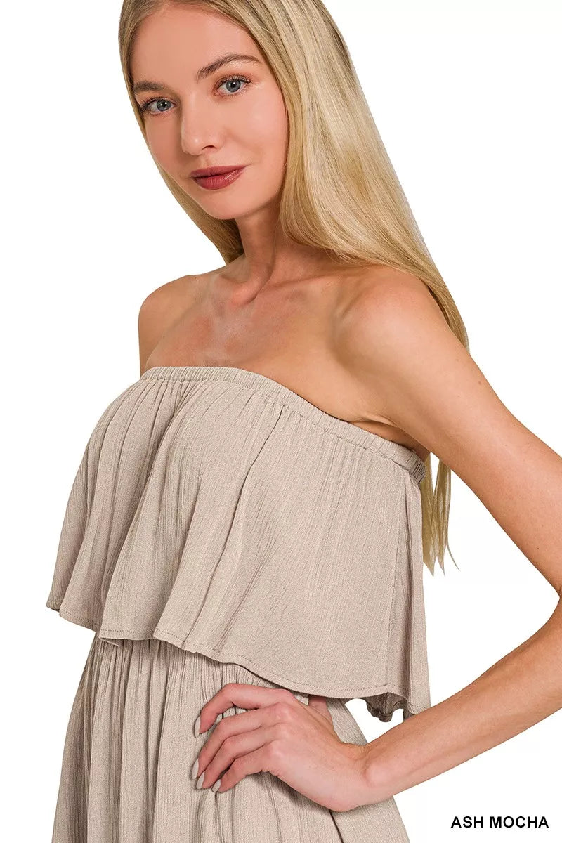 Pear Daisy Zenana woven crinkle strapless maxi dress displayed on a hanger, showcasing lightweight, flowing fabric and elegant design.