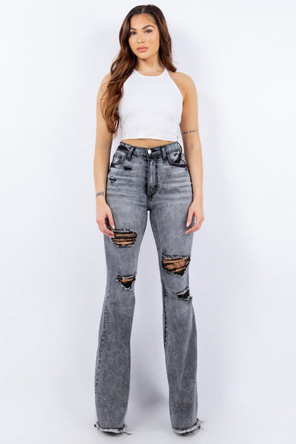 Grey Storm Bell Bottom Jeans by Jade Icarus, showing high-waisted fit, flared leg, and denim texture.