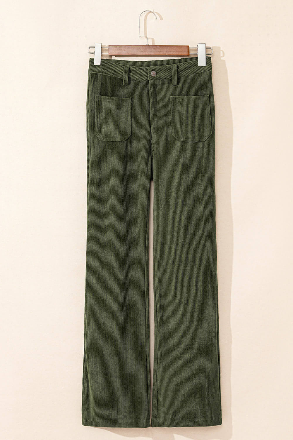 Green high waist corduroy pants with square pockets by Carmine Juneberry, featuring a stylish fit and textured fabric.