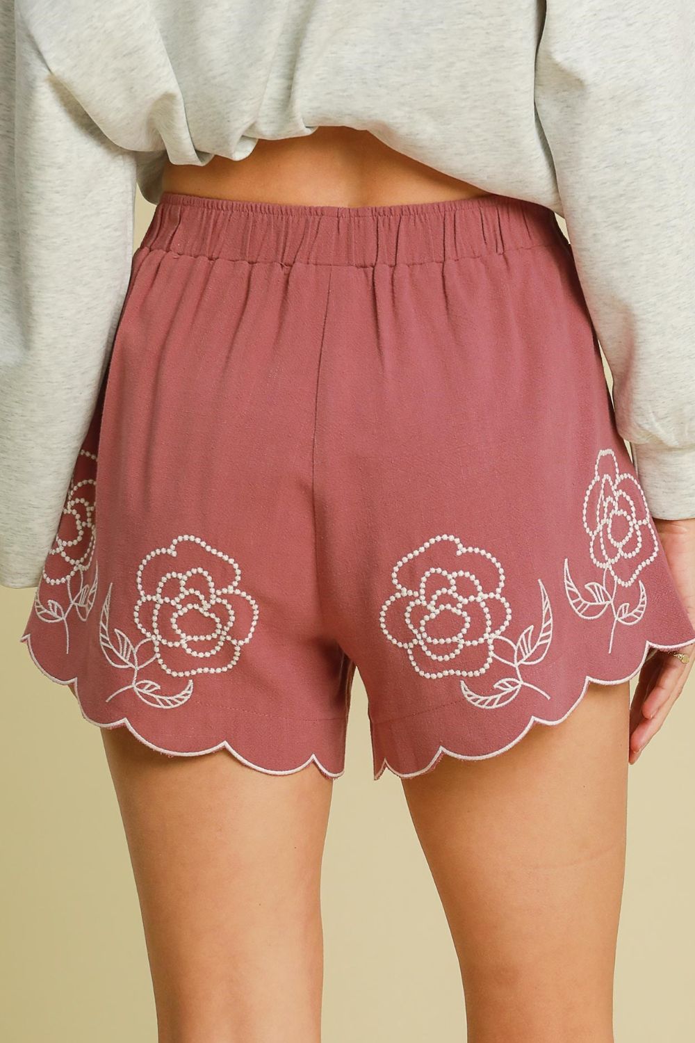 Women’s linen blend shorts with floral embroidery by Jade Icarus, featuring a relaxed fit and detailed embroidered floral accents.