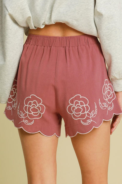Women’s linen blend shorts with floral embroidery by Jade Icarus, featuring a relaxed fit and detailed embroidered floral accents.