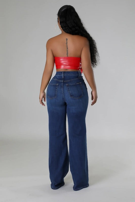 Dark denim Jade Icarus wide leg jeans with relaxed fit and high waist, shown on a model.