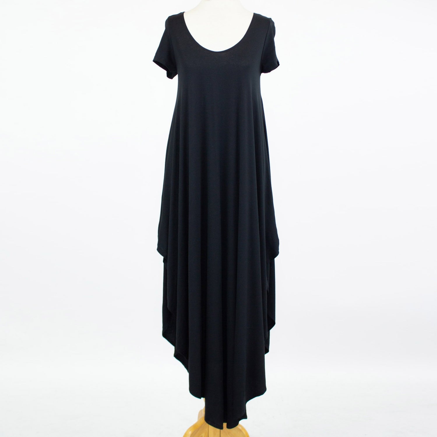 Yellow Hera side slit short sleeve casual maxi dress laid flat, showing its flowing fabric and relaxed fit.