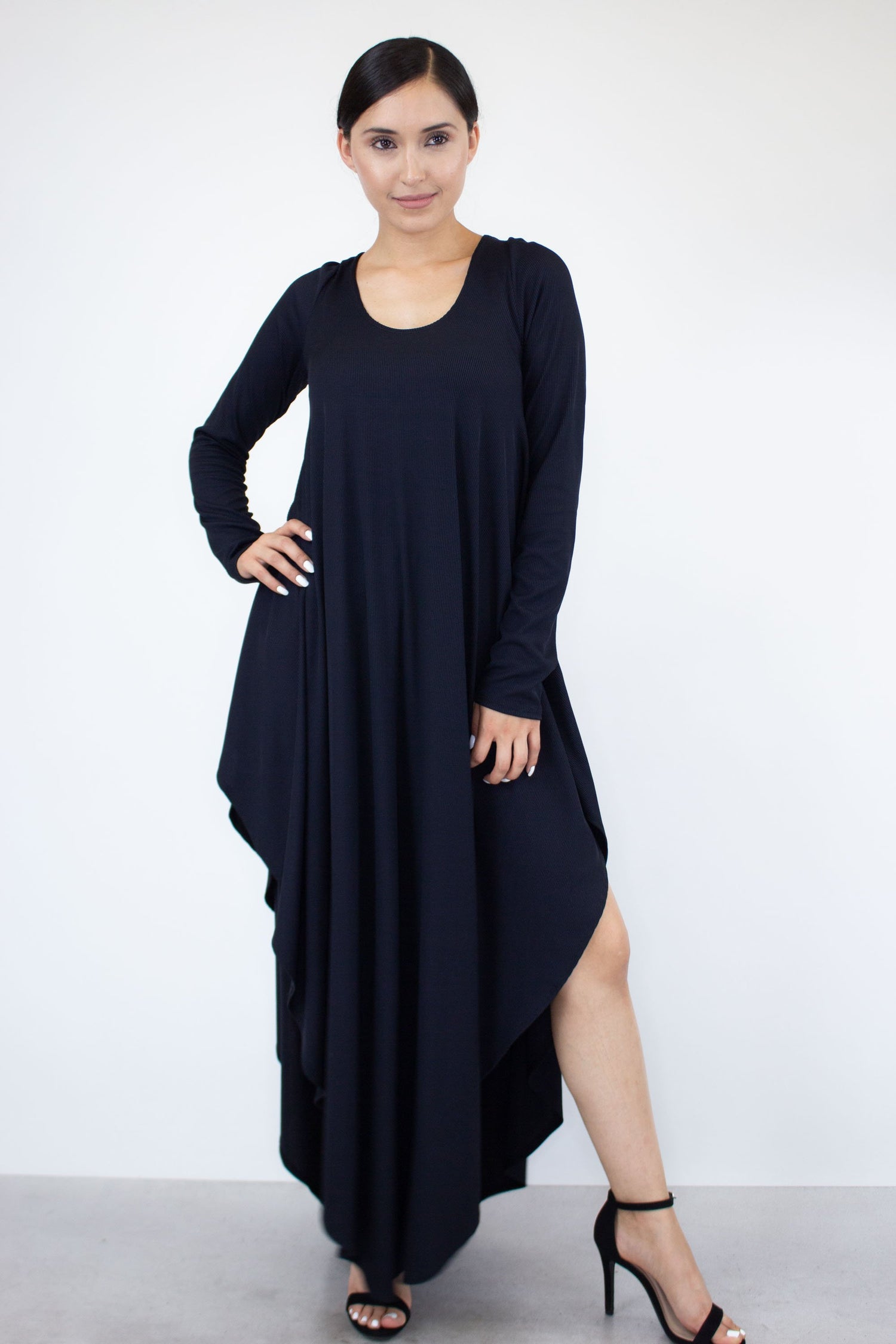 Yellow Hera asymmetric long sleeve maxi dress with flowing fabric and elegant design, displayed on a hanger.