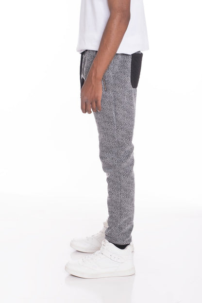 Black and grey static contrasted joggers by Lime Milo, showing the stylish tapered pants with elastic waistband and side pockets.