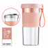 Maroon Asteria mini USB rechargeable portable electric fruit juicer on kitchen countertop with fresh fruits.