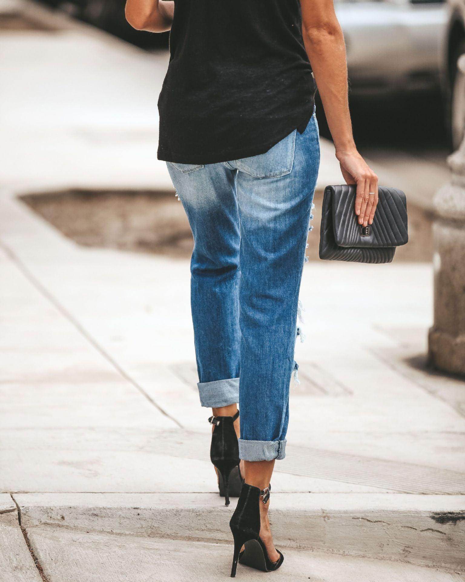 Carmine Juneberry large ripped jeans with distressed details and casual fit, shown on a model.