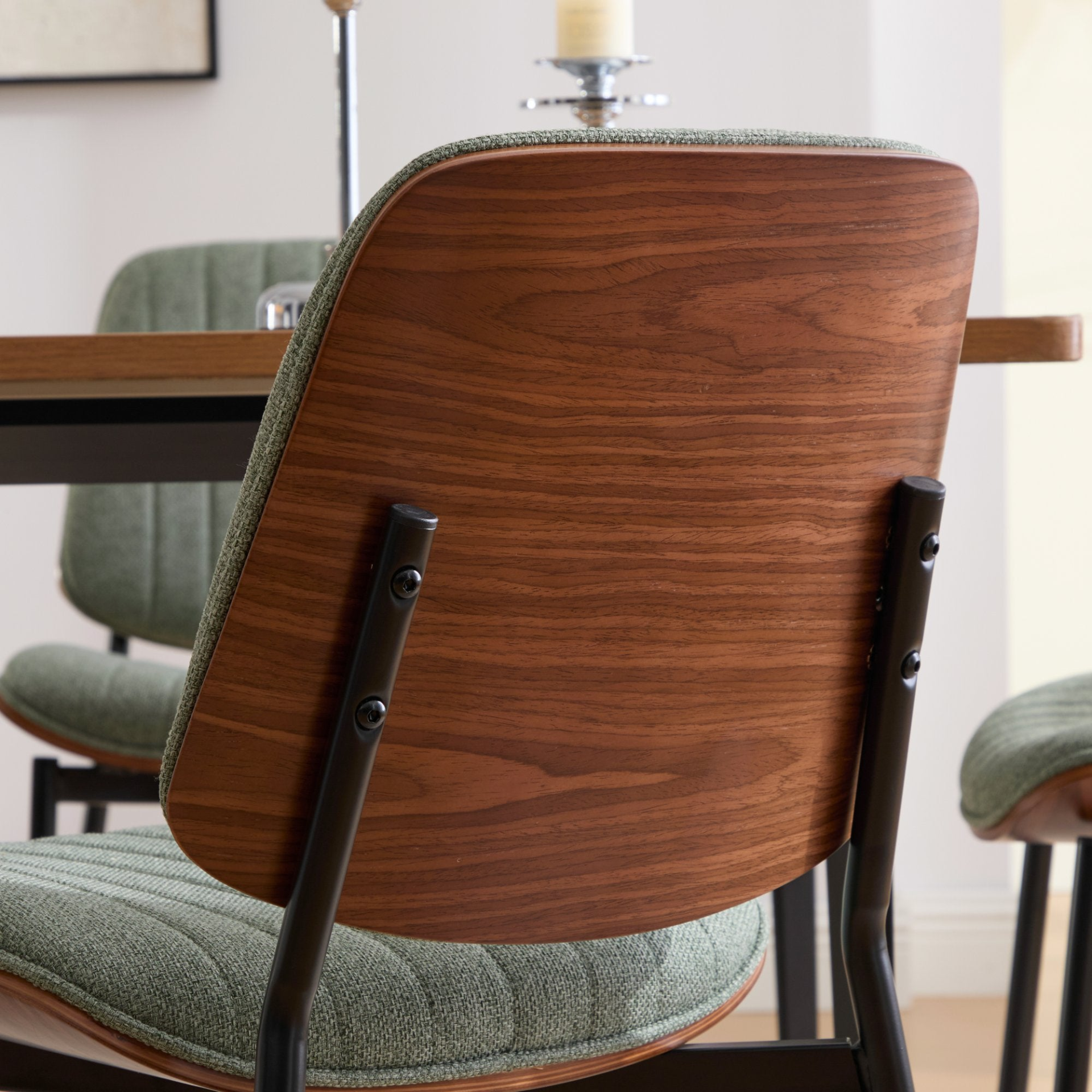 Pair of Mid Century Modern upholstered dining chairs with walnut bentwood backs, metal legs, and adjustable feet for kitchen or dining room.