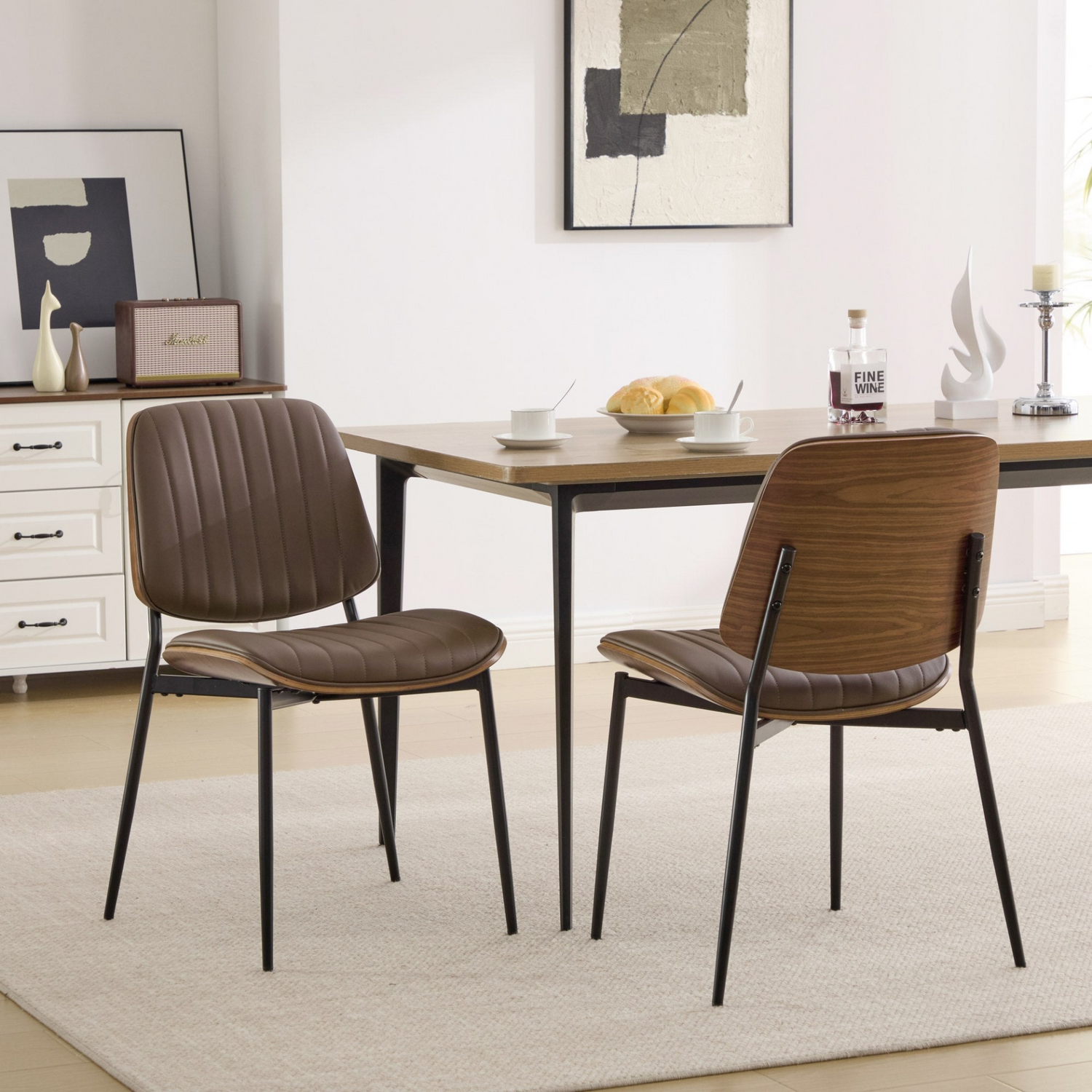 Set of 2 mid-century modern dining chairs with walnut bentwood backs, metal legs, and upholstered seats for kitchen and dining room.