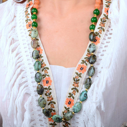 Patagonia Green Chrysocolla and gold long necklace with intricate beaded design, featuring vibrant green and gold accents.