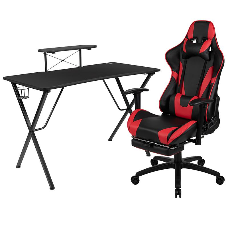 Start2Finish gaming desk with black surface and red accents, paired with a matching black and red gaming chair and footrest set.