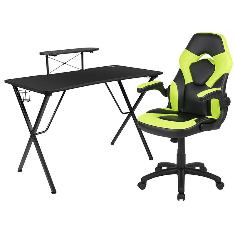 Black gaming desk with green accents and a green/black racing chair from Start2Finish, shown in a sleek, modern setup.