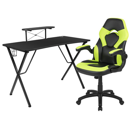 Black gaming desk with green accents and a green/black racing chair from Start2Finish, shown in a sleek, modern setup.